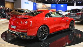 A red Nissan GT-R on display at an auto show
