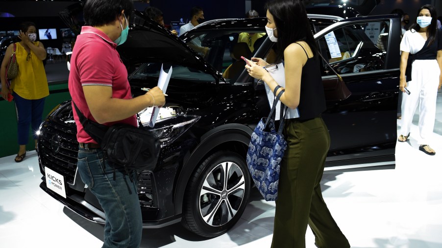 People inspect NISSAN KICKS during the 41st Bangkok International Motor Show 2020
