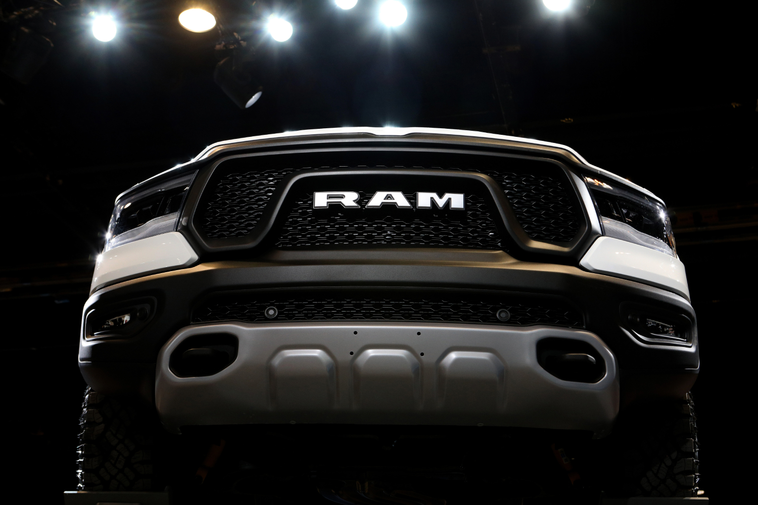 The front grille of a Ram 2500 on display at an auto show