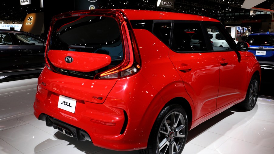 A red Kia Soul on display at an auto show
