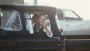 Actress yells out her truck window.