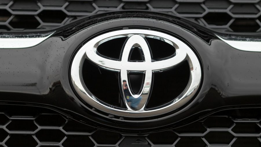A Toyota logo seen on the front of a RAV4