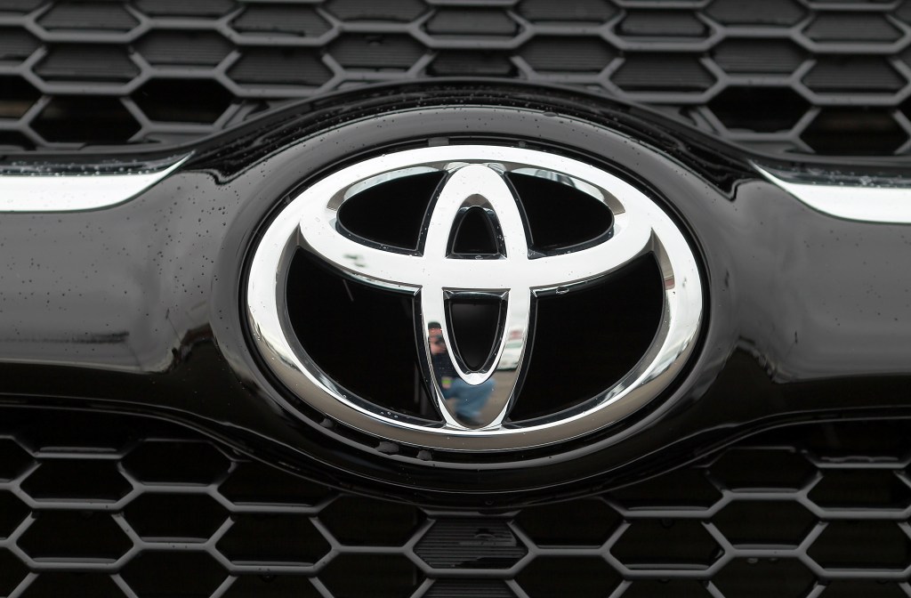 A Toyota logo seen on the front of a RAV4