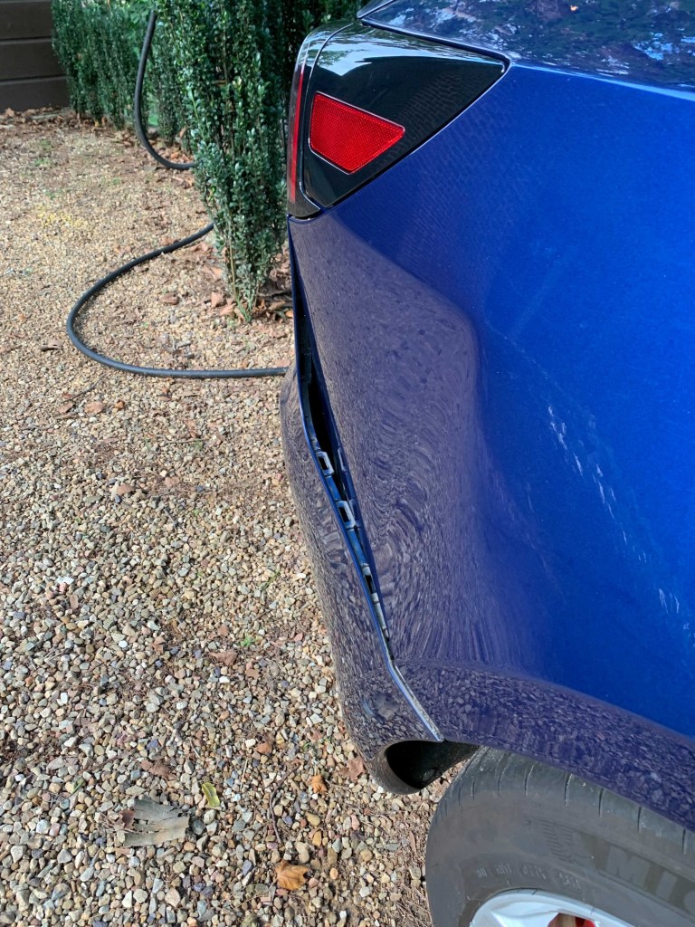 Another angle of the Tesla Model 3 rear panel damage