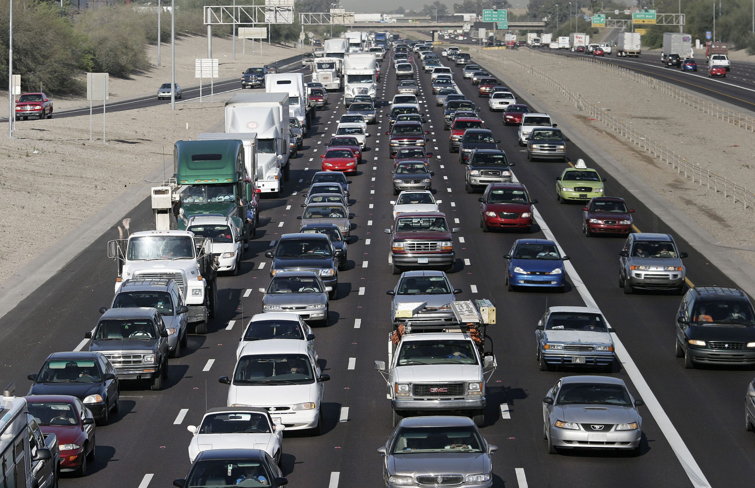 The morning rush hour commute on I10 shows a packed roadway.