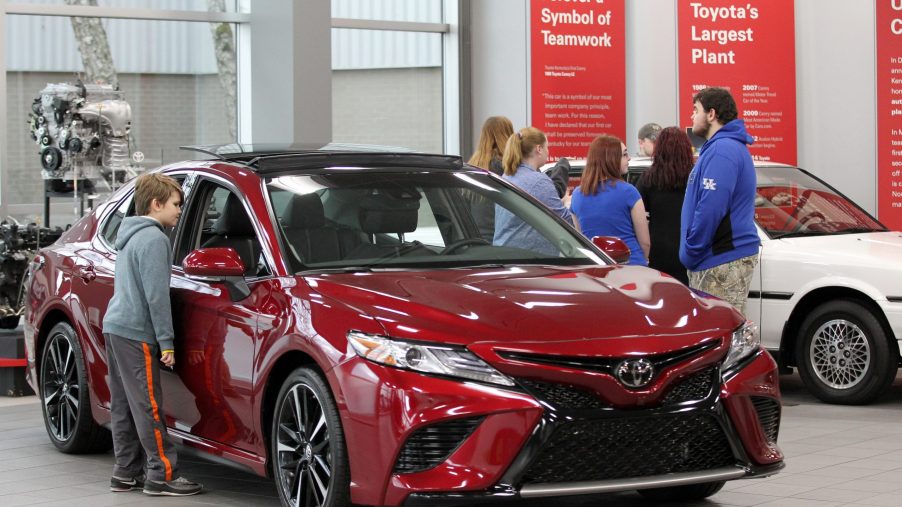 Visitors to the Toyota Motor Manufacturing plant look over the 2019 Toyota Camry