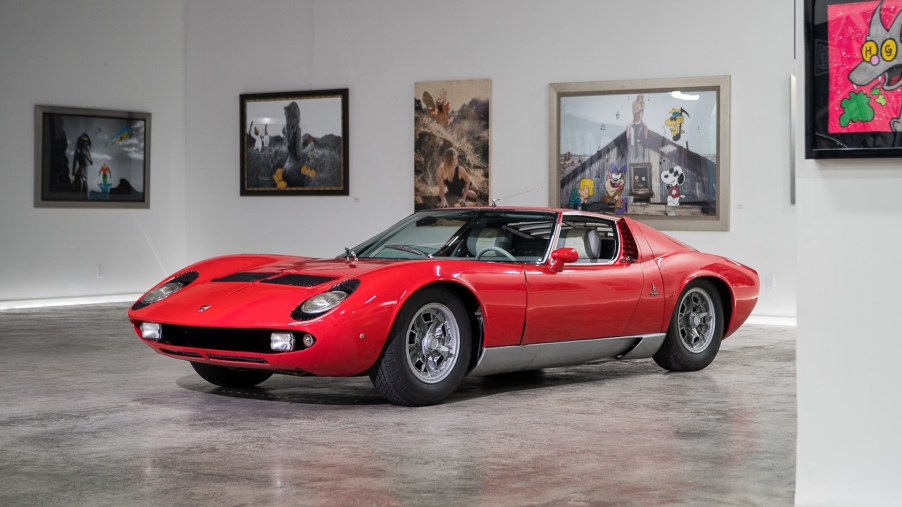 An image of a Lamborghini Miura S in an art gallery.