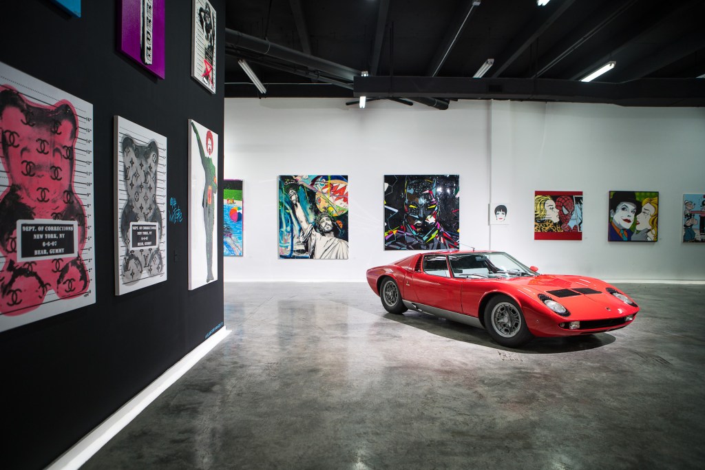 An image of a Lamborghini Miura S in an art gallery.