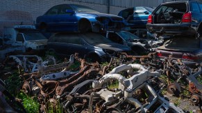 Scrap yard filled with old cars. Salvage title