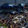 Scrap yard filled with old cars. Salvage title