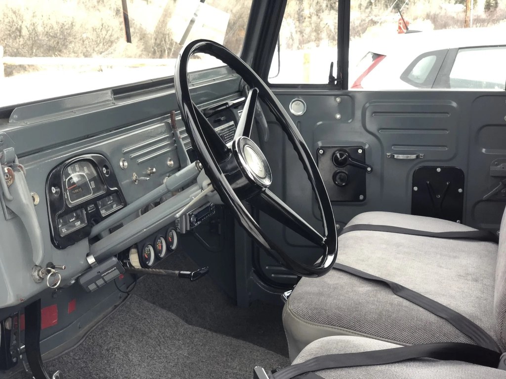 The gray seats and dashboard of a 1964 FJ45 Toyota Land Cruiser pickup