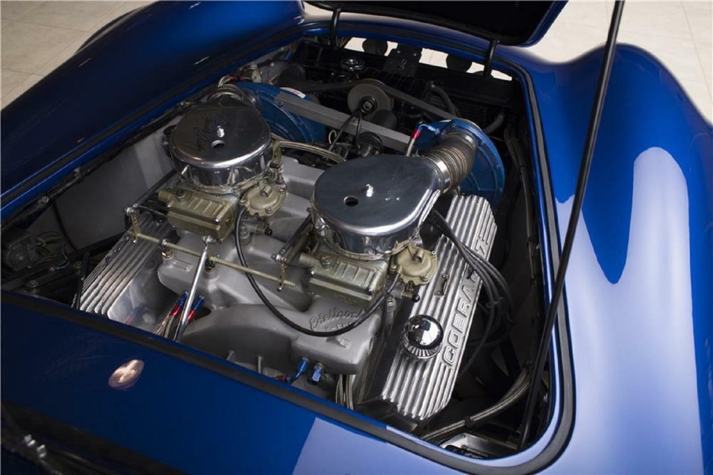 The twin-supercharged V8 under the hood of the blue 1966 Shelby Cobra 427 Super Snake