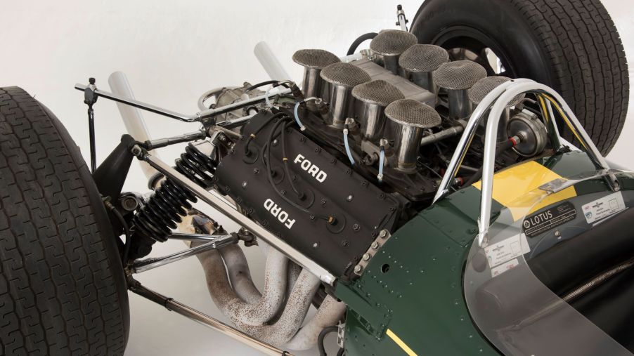 The rear-mounted V8 engine acting as a stressed member for the green-and-yellow 1967 Lotus 49 R3 DFV