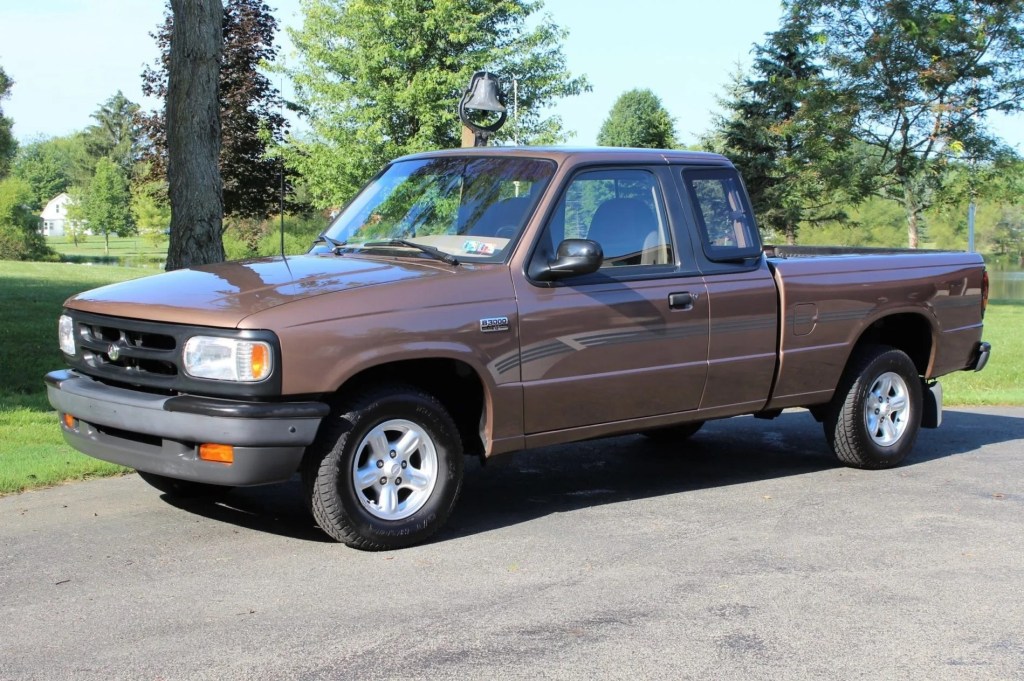 A brown 1994 Mazda B3000 SE Cab Plus parked on a driveway