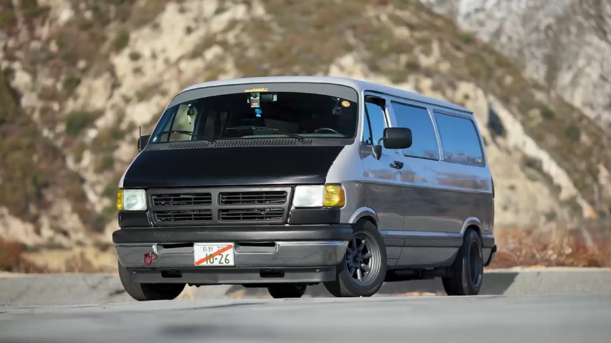 A gray-with-black-hood 1996 Dodge Ram van 'Dajiban' build in the California hills