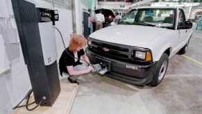 1997 Chevy S10 EV with woman charging