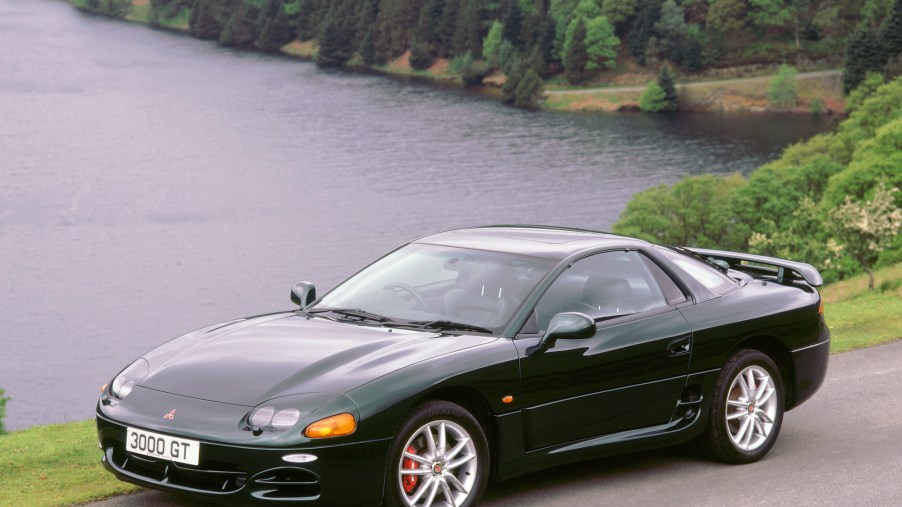 A black 1999 Mitsubishi 3000GT parked by a Welsh reservoir in 2000