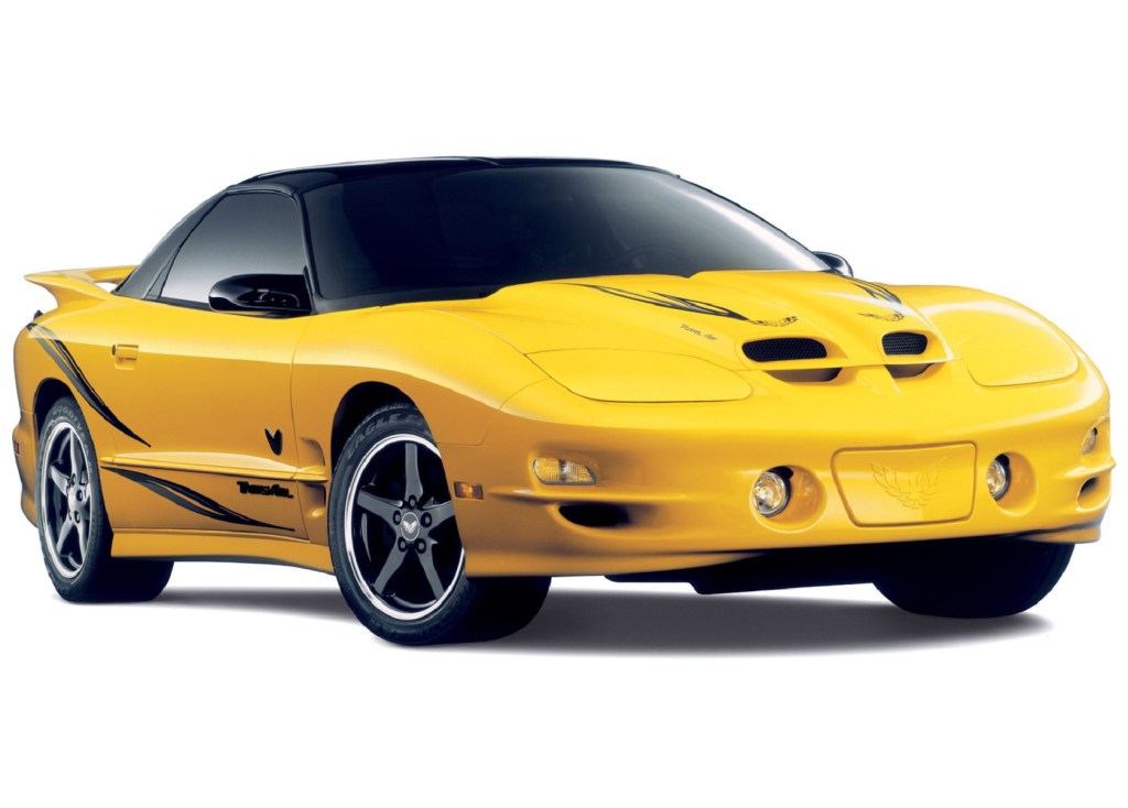 A yellow-with-silver-stripes 2002 Pontiac Firebird Trans Am WS6