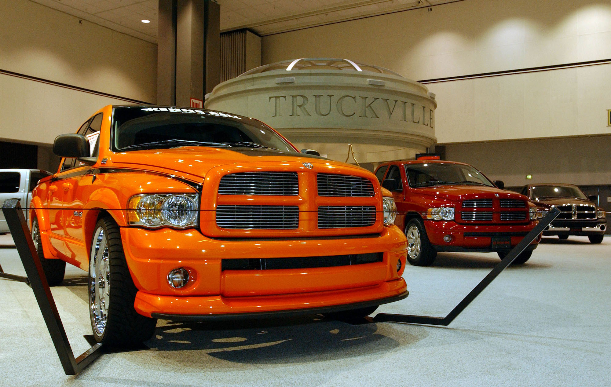 2003 Dodge Ram 2500 pickup trucks stand on display during media day at the Greater Los Angeles Auto Show on January 3, 2003, at the Los Angeles Convention Center.