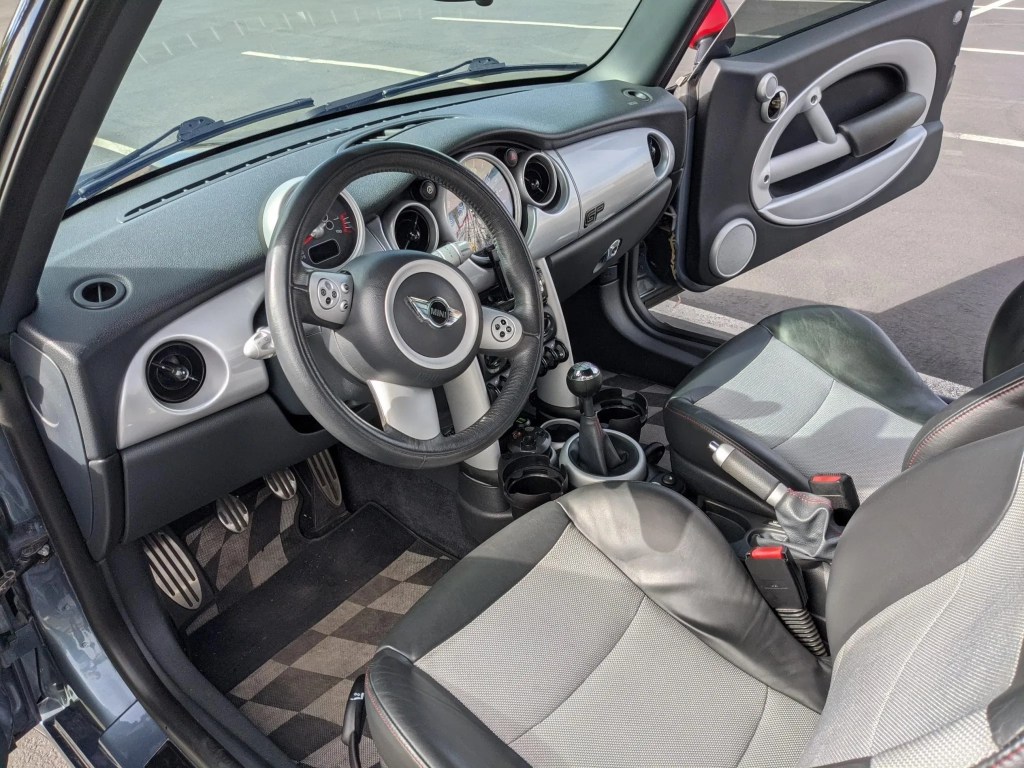 The gray-and-black front seats and dashboard of a 2006 Mini Cooper S John Cooper Works GP