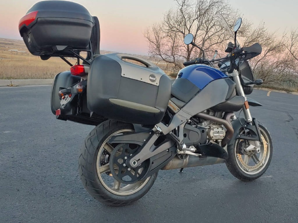 The rear 3/4 view of a blue 2008 Buell Ulysses XB12X