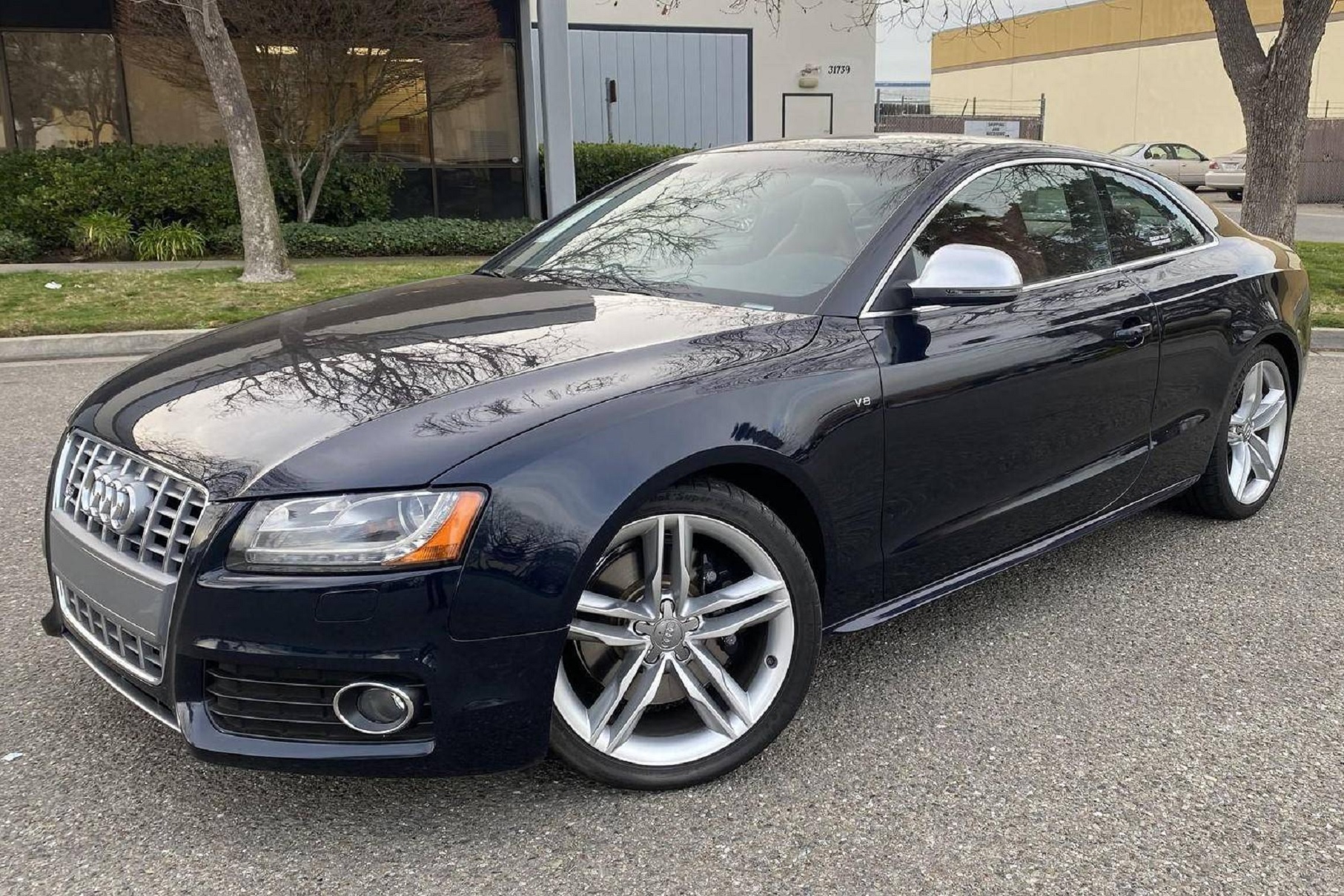 A dark-blue 2009 Audi S5 Coupe parked in a lot