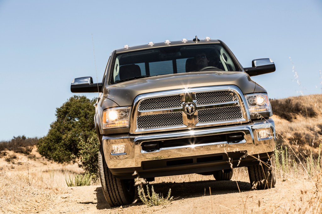 A forward-facing photo looking at the grille of a silver 2014 Ram 2500 Heavy-Duty truck
