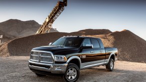 A black and silver 2016 Ram 2500 Laramie Crew Cab 4x4 Heavy Duty with a Cummins Diesel engine
