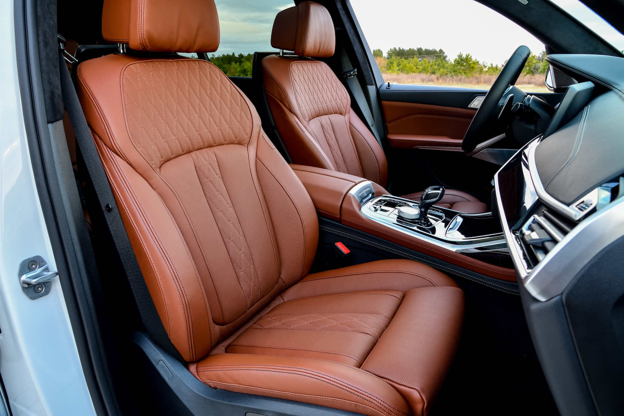 A 2020 BMW X7's orange quilted-leather front seats