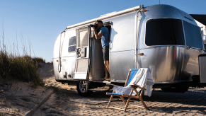 The Airstream Bambi parked at a beach.