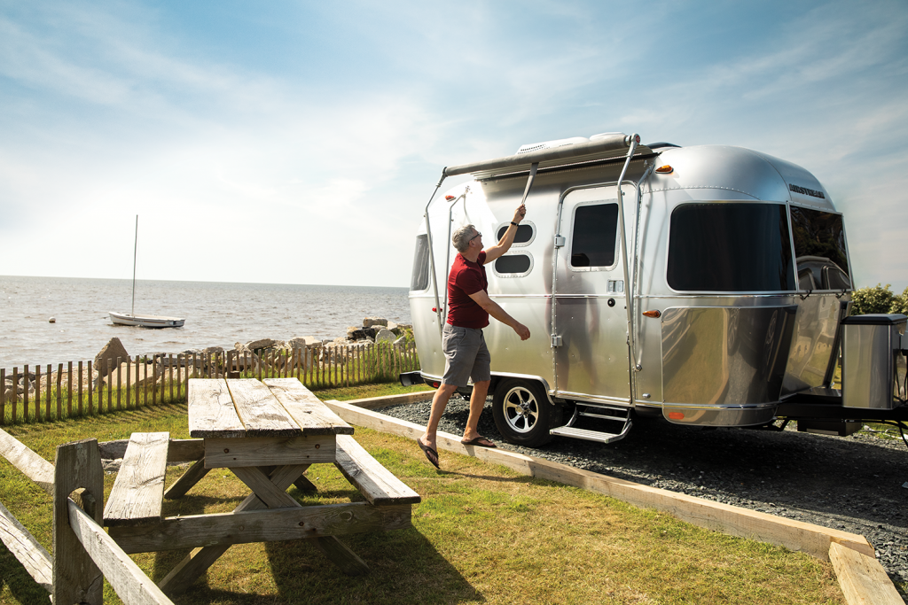 An Airstream parked at a campground.