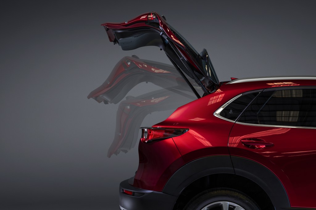 The liftgate, which has been recalled, in action on a red 2020 Mazda CX-30