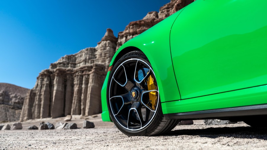 A 2021 911 Turbo S in Python Green parked in a desert