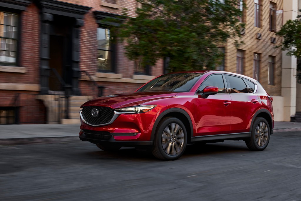 A red 2021 Mazda CX-5 parked on a street.