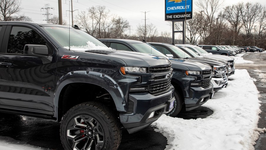 A row of Chevrolet Silverado trucks in a snow-covered parking lot at the Exchange Chevrolet in Lake Bluff, Illinois, on January 5, 2021