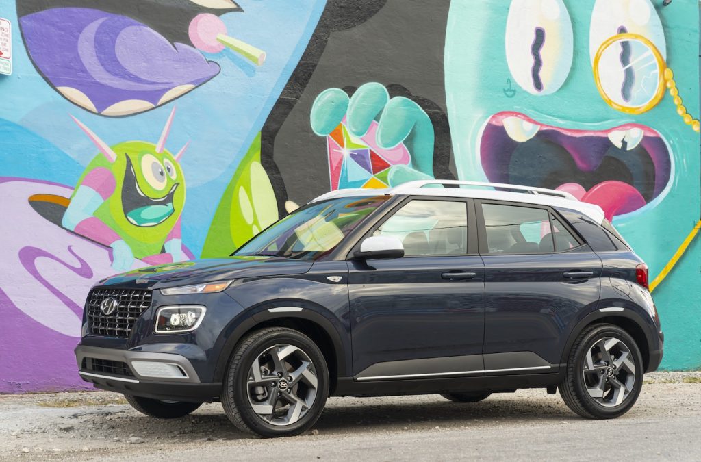 The Hyundai Venue parked in front of graffiti 