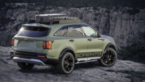 A green 2021 Kia Sorento Yosemite Edition parked on a rocky clif