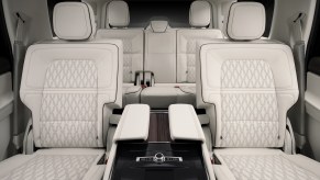 A 2021 Lincoln Navigator Black Label SUV's white and gray leather seating with Chalet theming