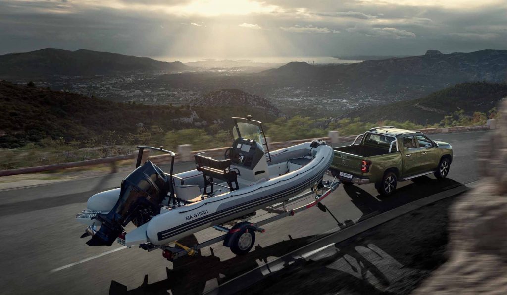 2021 Peugeot Landtrek pickup towing a boat