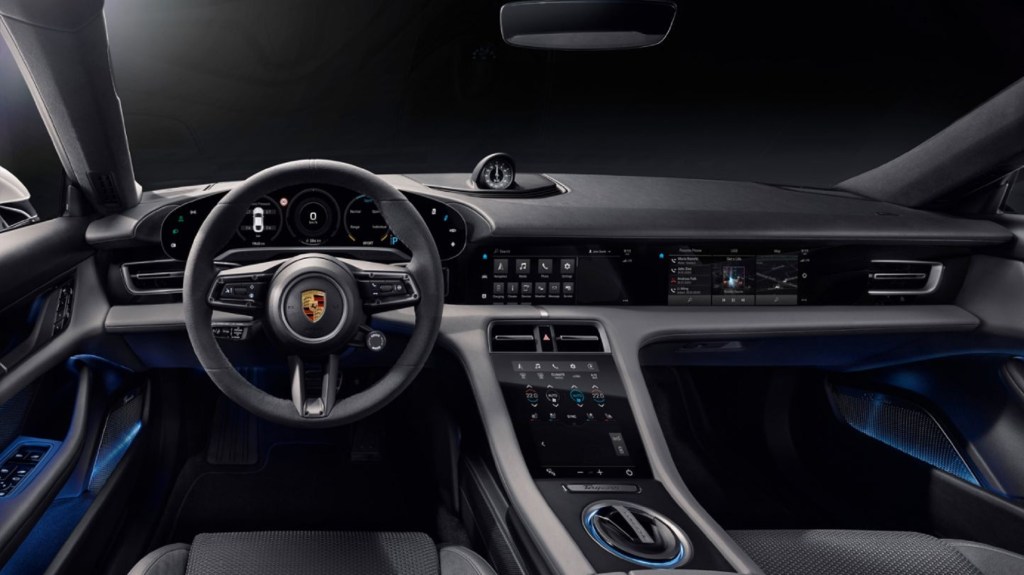 The gray-and-black front seats and dashboard of the 2021 Porsche Taycan Turbo