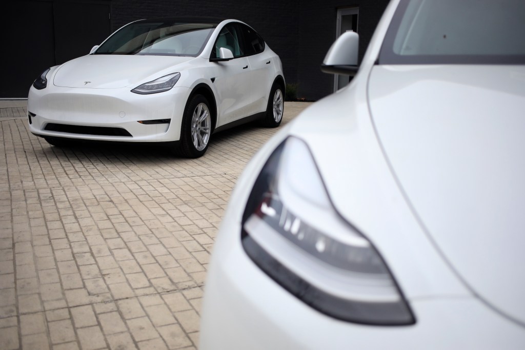 Two white Tesla Model S electric vehicles for sale outside a dealership at the Easton Town Center Mall in Columbus, Ohio, U.S., on Thursday, Jan. 7, 2021.