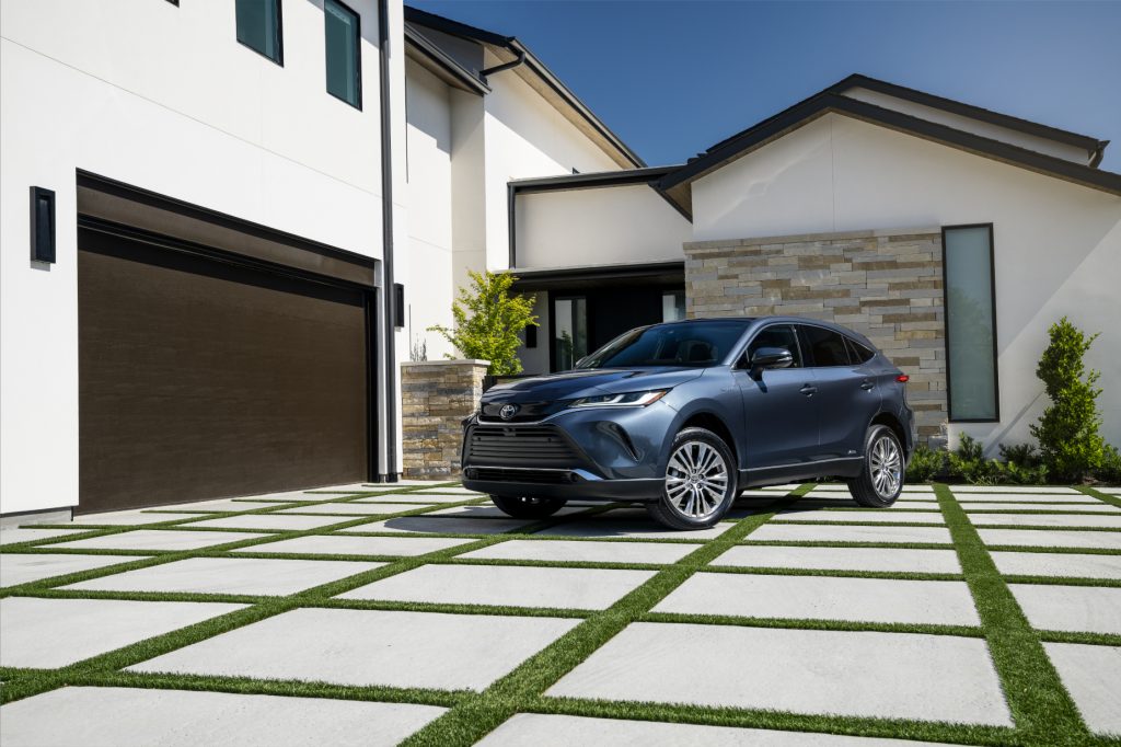 A blue 2021 Toyota Venza parked in a driveway