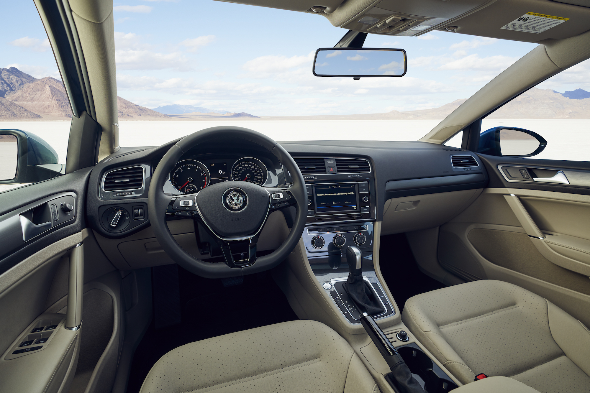 Beige cockpit in a 2021 Volkswagen Golf four-door hatchback