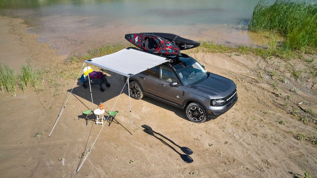 2021 Ford Bronco Sport in a feild wearing the new Water themed bundle with kayaks