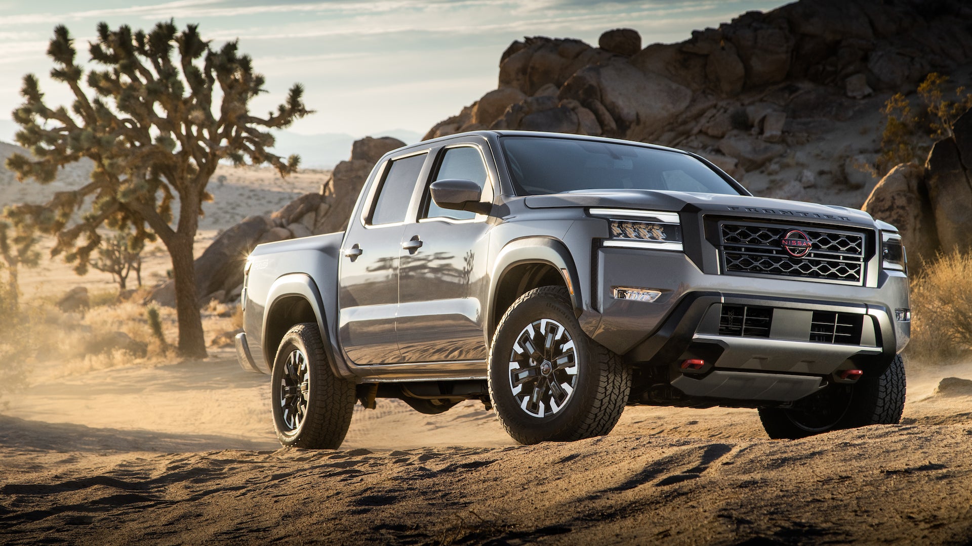 a 2022 nissan frontier driving in the desert