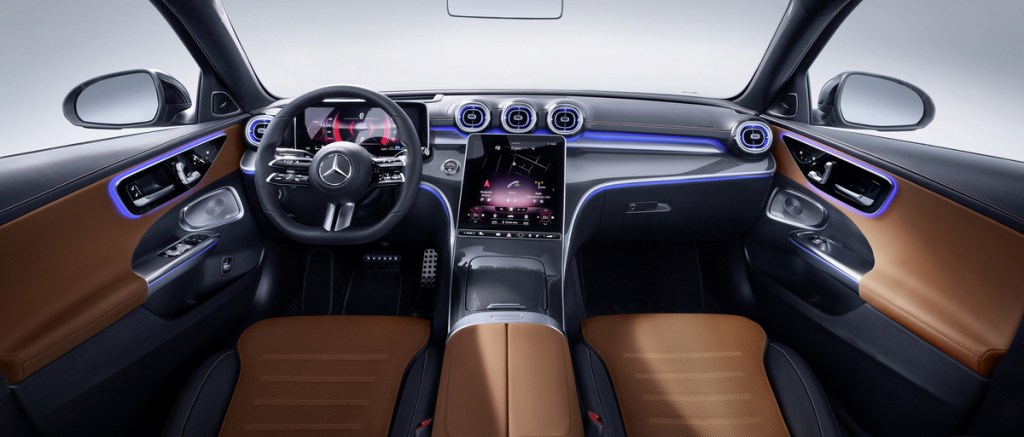 Brown and black interior of the 2022 Mercedes-Benz C-Class, a view of the front seats and dashboard