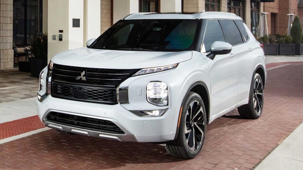 2022 Mitsubishi Outlander in white parked on brick road