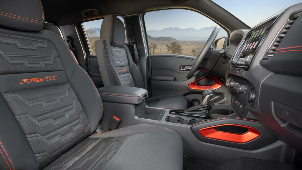 An interior shot of the 2022 Nissan Interior with red and black color scheme