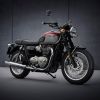 A red-and-silver 2022 Triumph Bonneville T120 in front of a gray background