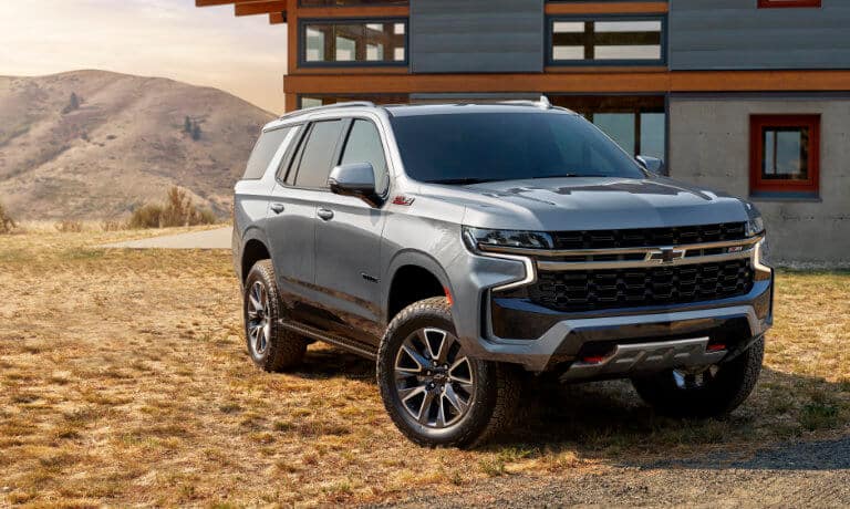 The 2023 Chevy Tahoe parked near a home